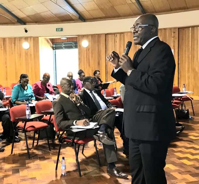 Ezekiel Tumbo of TSC Quality Assurance & Standards Directorate addresses service providers at a Teacher Professional Development Training workshop on 12th February 2020.
